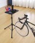 Stationary adjustable bike exercise table with support