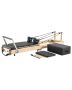 Foldable wooden Pilates reformer with dual resistance, up to 180 kg